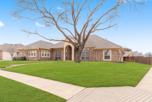 ranch-style home featuring a front yard