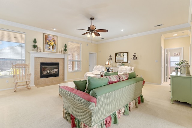 bedroom featuring ceiling fan, light colored carpet, multiple windows, and crown molding