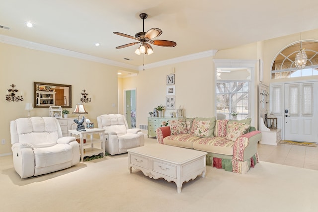 living room featuring ceiling fan with notable chandelier, light colored carpet, and ornamental molding