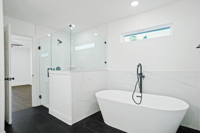 bathroom with separate shower and tub