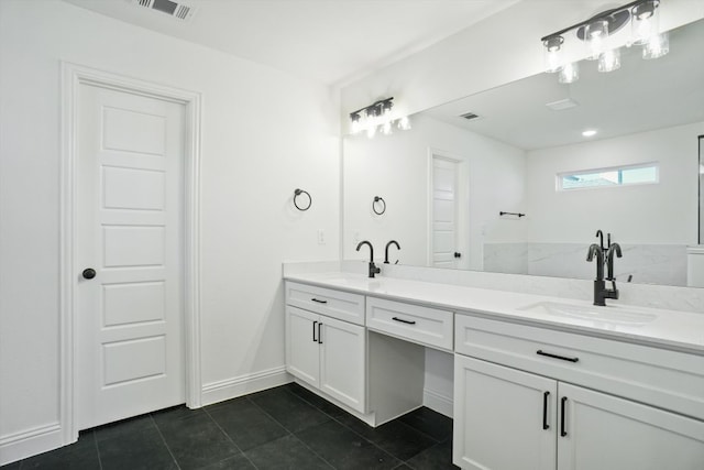 bathroom with vanity and tile patterned flooring