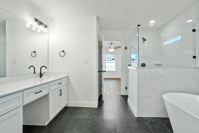 bathroom featuring tile patterned flooring, shower with separate bathtub, and vanity