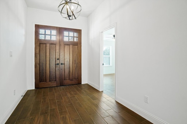 foyer featuring a chandelier