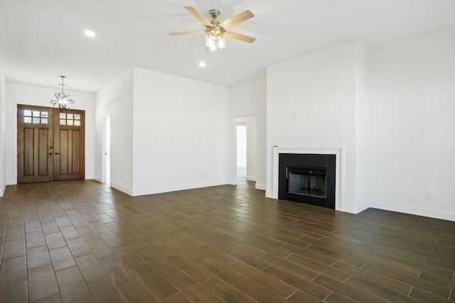 unfurnished living room with ceiling fan