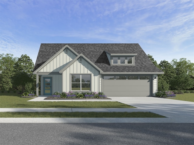 view of front of property with a front lawn and a garage