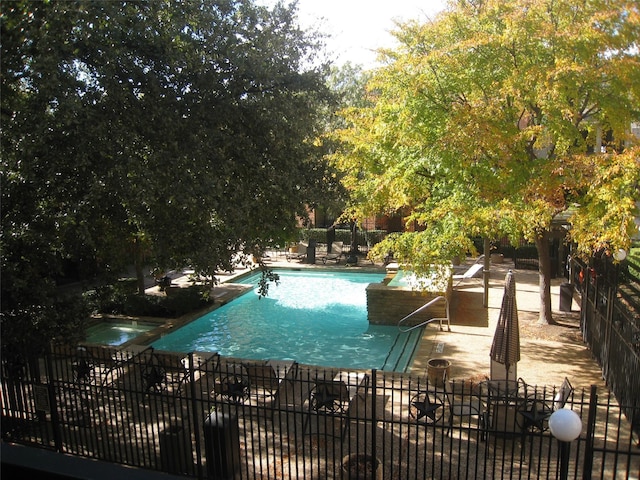 view of swimming pool featuring a patio area