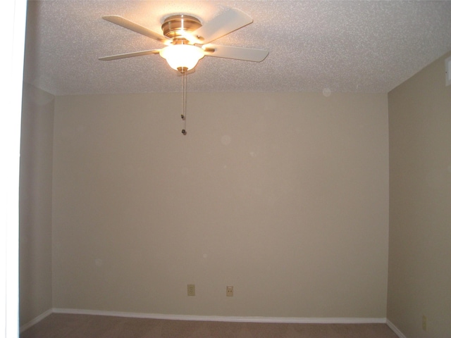 spare room featuring a textured ceiling, ceiling fan, and carpet flooring