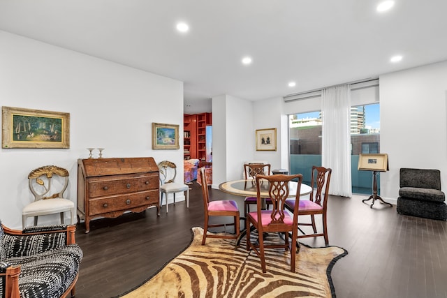 dining area featuring dark wood-type flooring