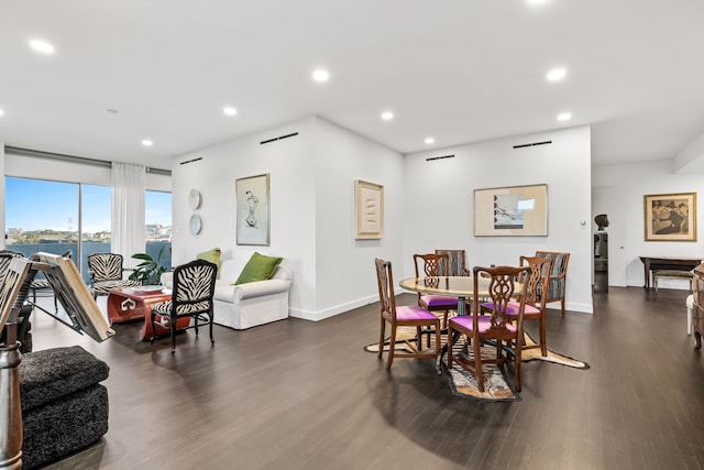 dining area featuring dark hardwood / wood-style floors