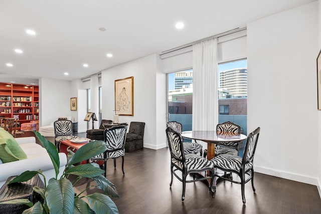 dining area featuring dark wood-type flooring