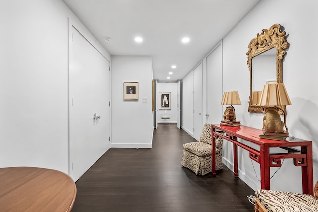 corridor with dark hardwood / wood-style floors