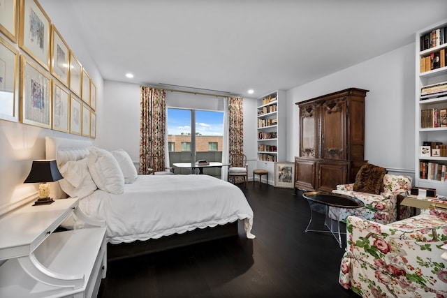 bedroom with hardwood / wood-style floors