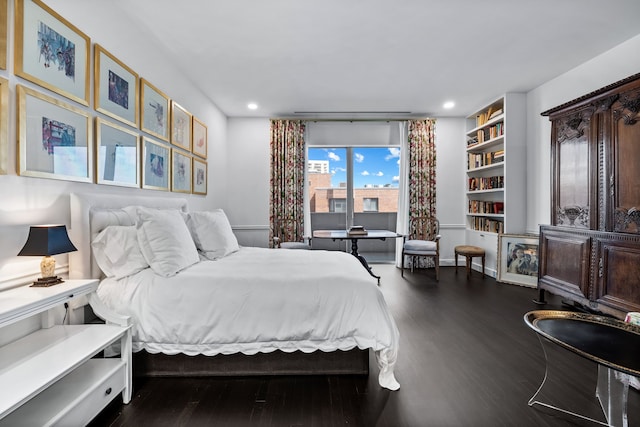 bedroom featuring dark wood-type flooring