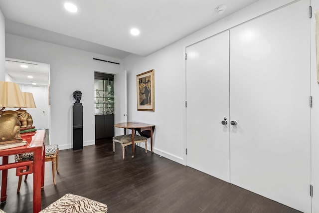 hallway with dark wood-type flooring