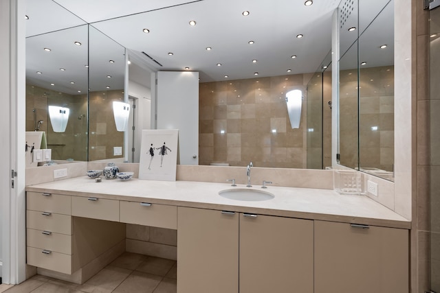 bathroom with vanity, tile walls, and tile patterned floors