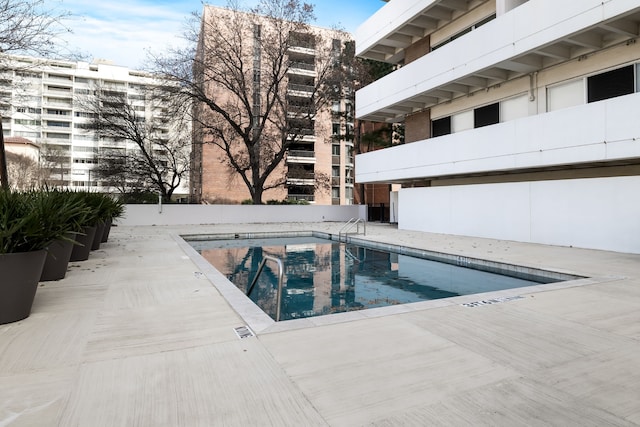 view of swimming pool featuring a patio