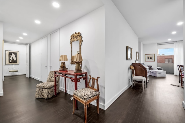 hallway with dark hardwood / wood-style floors