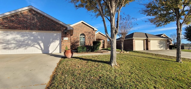 front of property featuring a garage and a front lawn