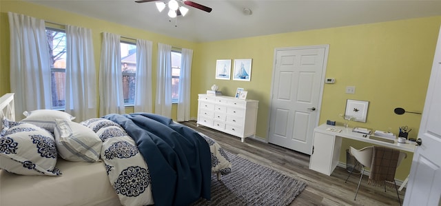 bedroom featuring hardwood / wood-style floors and ceiling fan