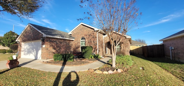 view of front of home with a garage and a front yard