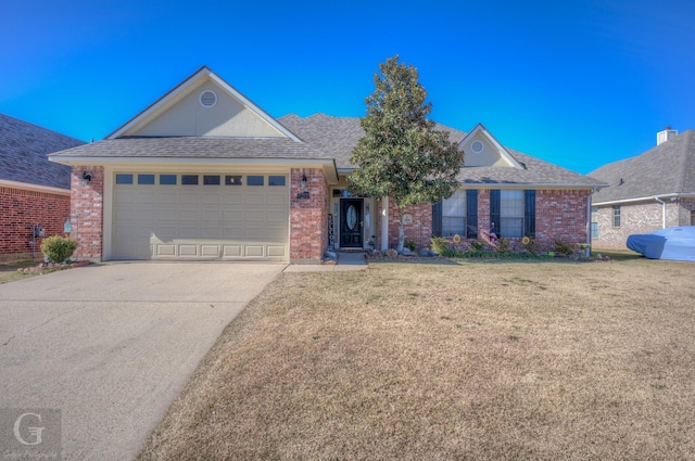 ranch-style house with brick siding, an attached garage, concrete driveway, and a front lawn