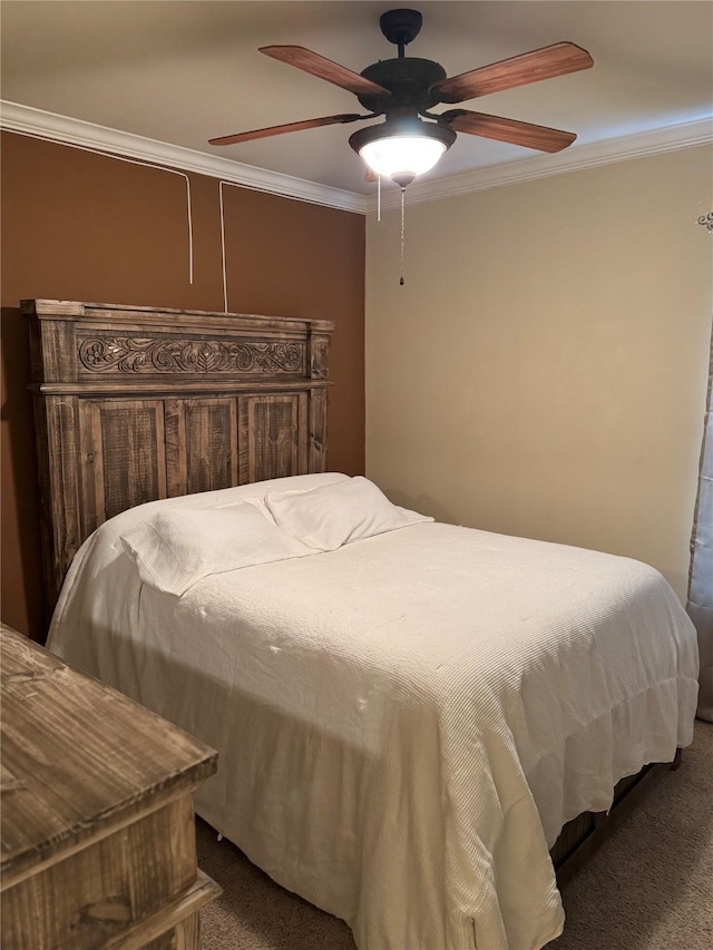 bedroom with carpet floors, a ceiling fan, and crown molding