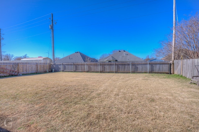 view of yard featuring a fenced backyard