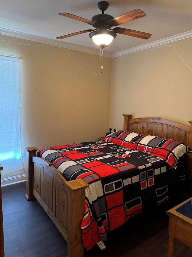 bedroom with ceiling fan, ornamental molding, and wood finished floors