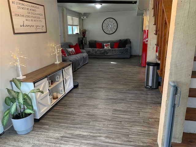 living room with dark hardwood / wood-style flooring