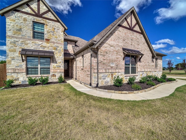 view of front of property with a front lawn