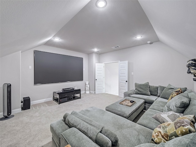 carpeted living room with a textured ceiling and lofted ceiling