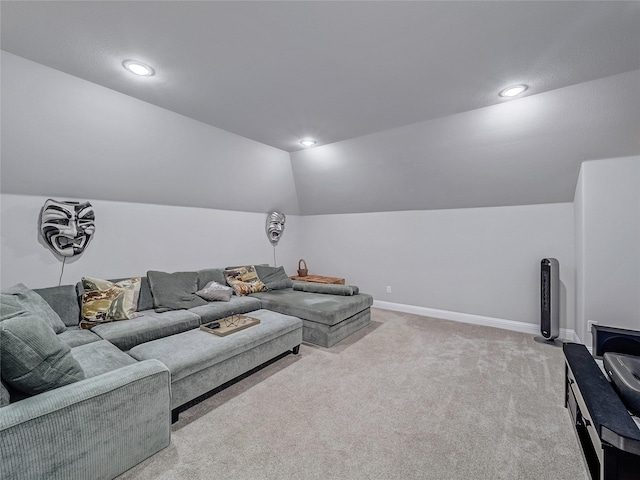 carpeted living room featuring vaulted ceiling