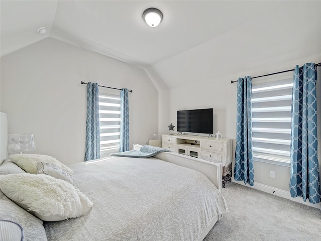 bedroom with carpet and vaulted ceiling