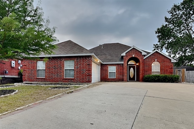 single story home with a garage