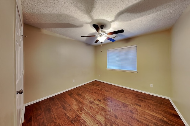 spare room with a textured ceiling, ceiling fan, and hardwood / wood-style floors