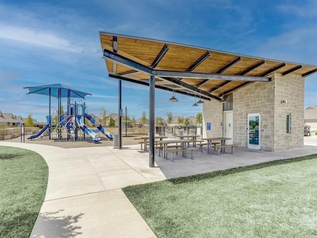 view of community featuring a playground and a yard