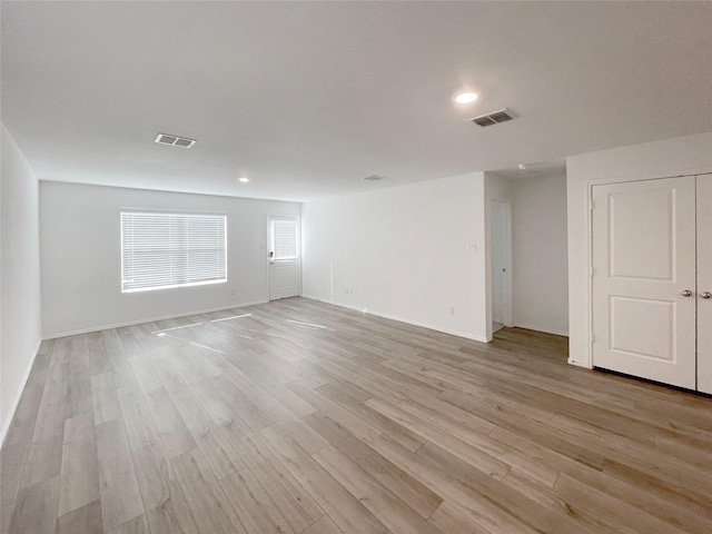 spare room with light hardwood / wood-style flooring