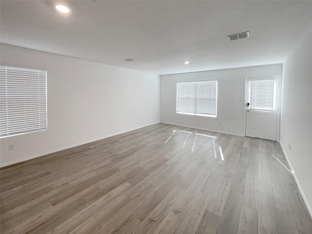 empty room with light wood-type flooring