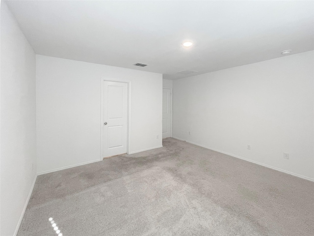 spare room with light colored carpet