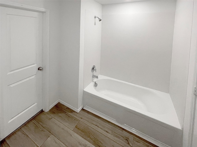 bathroom featuring shower / bath combination and wood-type flooring