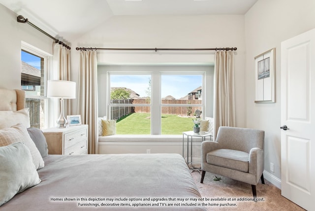 carpeted bedroom featuring lofted ceiling and multiple windows