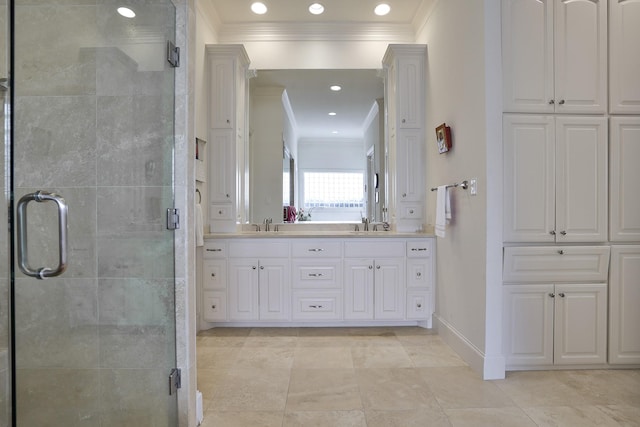 bathroom with crown molding, vanity, and a shower with shower door