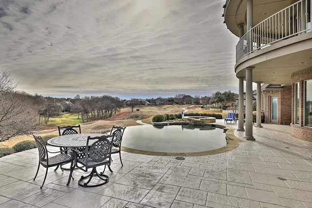 view of patio with a balcony