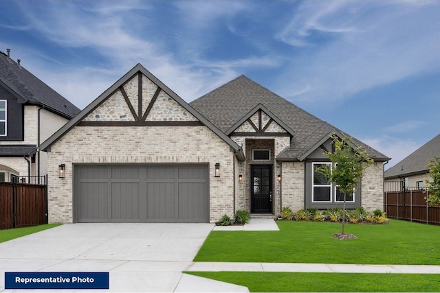 view of front facade with a garage and a front yard