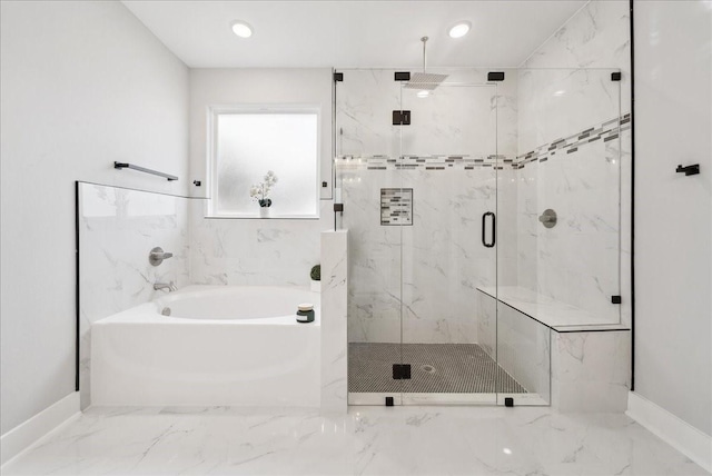 bathroom featuring shower with separate bathtub