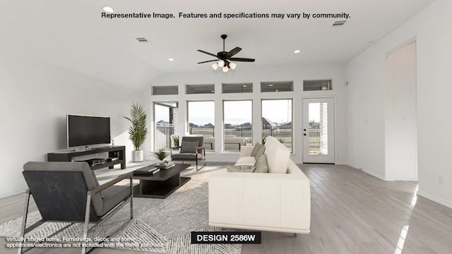 living room with light wood-type flooring and ceiling fan