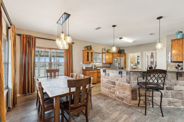 dining area featuring hardwood / wood-style floors