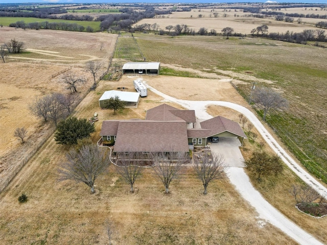 birds eye view of property with a rural view