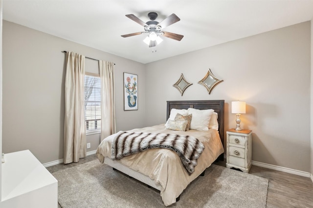 bedroom with ceiling fan and hardwood / wood-style flooring