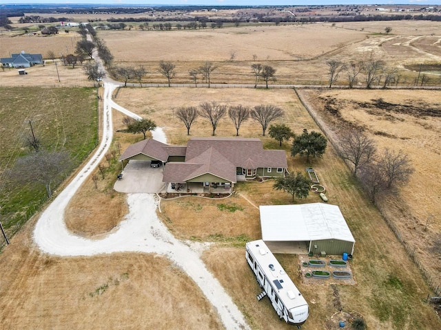 birds eye view of property featuring a rural view